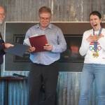 Soldotna Mayor Paul Whitney and Kenai Mayor Brian Gabriel proclaim Dec. 28, 2024, as Kristen Faulkner Day in Soldotna and Kenai, in recognition of Kristen Faulkners two gold medal wins at the Paris 2024 Olympics during a meet and greet hosted by the Kenai and Soldotna chambers of commerce at the Cannery Lodge in Kenai, Alaska, on Saturday, Dec. 28, 2024. (Jake Dye/Peninsula Clarion)