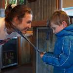 Kristen Faulkner, who won two gold medals for cycling at the Paris 2024 Olympics, speaks to Andrew Elam during a meet and greet hosted by the Kenai and Soldotna chambers of commerce at the Cannery Lodge in Kenai, Alaska, on Saturday, Dec. 28, 2024. (Jake Dye/Peninsula Clarion)