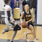 Cook Inlet Academys Clara Warren drives against Ninilchiks Lucy Reynolds on Tuesday, Jan. 7, 2025, at Ninilchik School in Ninilchik, Alaska. (Photo by Jeff Helminiak/Peninsula Clarion)