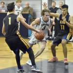 Ninilchiks Onyx Allen brings the ball up in front of Cook Inlet Academys Hyrum Henderson on Tuesday, Jan. 7, 2025, at Ninilchik School in Ninilchik, Alaska. (Photo by Jeff Helminiak/Peninsula Clarion)
Ninilchiks Kade McCorison drives on Cook Inlet Academys Lucas Oyoumick on Tuesday, Jan. 7, 2025, at Ninilchik School in Ninilchik, Alaska. (Photo by Jeff Helminiak/Peninsula Clarion)