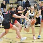 Nikiskis Evelyn Reichert drives through the Kenai Central defense Thursday, Jan. 9, 2025, at Nikiski Middle-High School in Nikiski, Alaska. (Photo by Jeff Helminiak/Peninsula Clarion)
