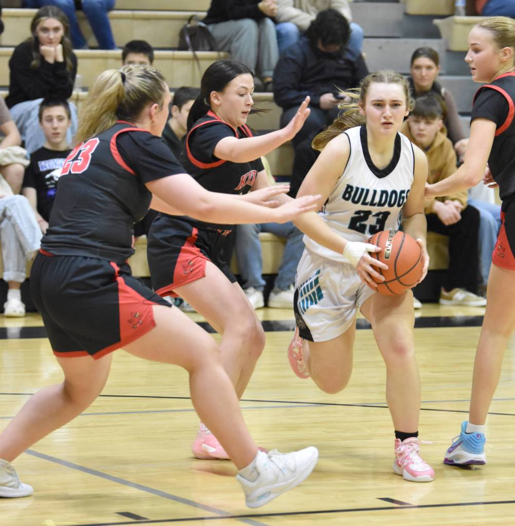 Nikiskis Evelyn Reichert drives through the Kenai Central defense Thursday, Jan. 9, 2025, at Nikiski Middle-High School in Nikiski, Alaska. (Photo by Jeff Helminiak/Peninsula Clarion)