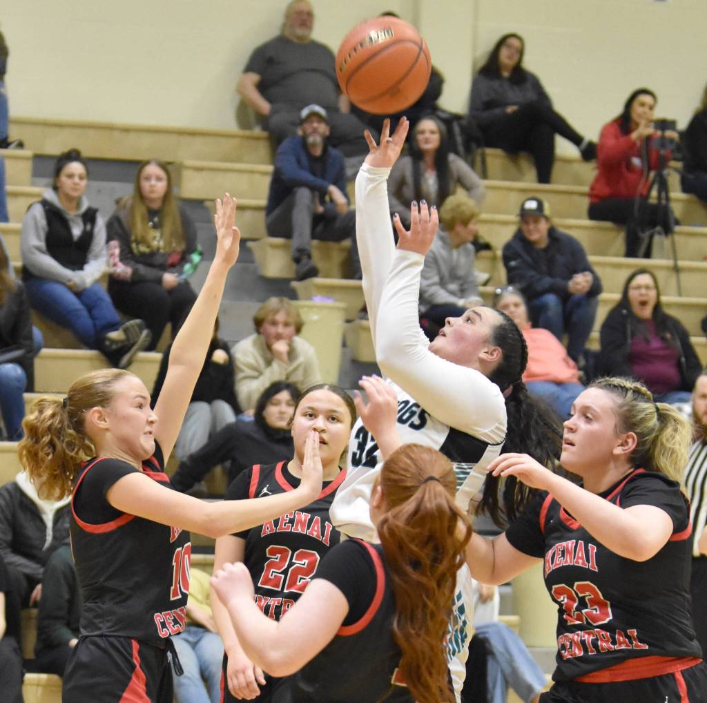 Nikiskis Kailey Stynsberg shoots over the Kenai Central defense Thursday, Jan. 9, 2025, at Nikiski Middle-High School in Nikiski, Alaska. (Photo by Jeff Helminiak/Peninsula Clarion)