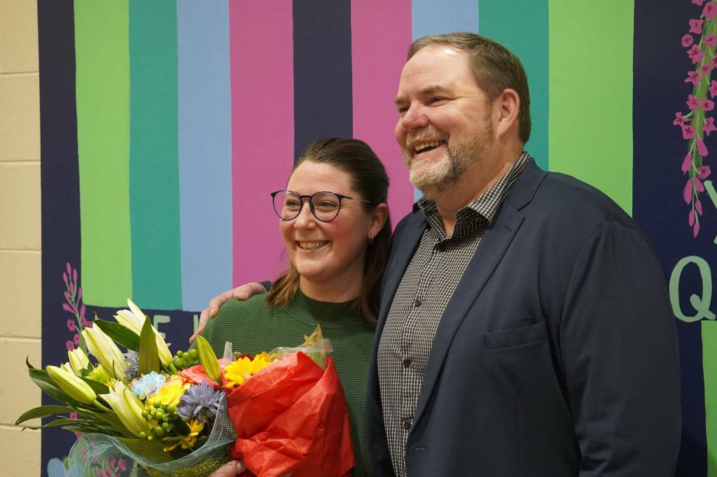 Mountain View Elementary School Assistant Principal Aubrie Ellis stands for a photo with Superintendent Clayton Holland after she was named National Outstanding Assistant Principal of 2025 by the Alaska Association of Elementary School Principals at Mountain View Elementary School in Kenai, Alaska, on Friday, Jan. 10, 2025. (Jake Dye/Peninsula Clarion)
