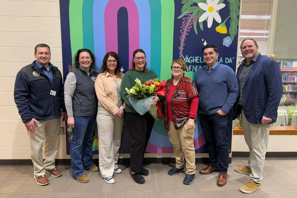 KPBSD Human Resources Director Nate Crabtree, KPBSD Assistant Superintendent Kari Dendurent, Nikiski North Star Principal Jenna Fabian, Mountain View Assistant Principal Aubrie Ellis, KPBSD Board of Education Member Patti Truesdell, Rep. Justin Ruffridge and KPBSD Superintendent Clayton Holland stand for a photo after Ellis was named National Outstanding Assistant Principal of 2025 by the Alaska Association of Elementary School Principals at Mountain View Elementary School in Kenai, Alaska, on Friday, Jan. 10, 2025. (Jake Dye/Peninsula Clarion)