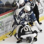 Souths Carson Lake and Vance Schmidt and Soldotnas Marshall DeRaeve and Zack Zurfluh battle for the puck Friday, Jan. 10, 2025, at the Soldotna Regional Sports Complex in Soldotna, Alaska. (Photo by Jeff Helminiak/Peninsula Clarion)
