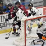 Carter McCormick and Riley Mullen of the Kenai River Brown Bears and Luca Ricciardi and Adam Timm of the Fairbanks Ice Dogs battle for the puck Saturday, Jan. 11, 2025, at the Soldotna Regional Sports Complex in Soldotna, Alaska. (Photo by Jeff Helminiak/Peninsula Clarion)