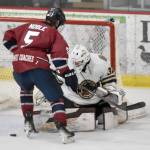 Kenai River Brown Bears goalie Owen Zenone turns back Mason Noble of the Fairbanks Ice Dogs on Saturday, Jan. 12, 2025, at the Soldotna Regional Sports Complex in Soldotna, Alaska. (Photo by Jeff Helminiak/Peninsula Clarion)