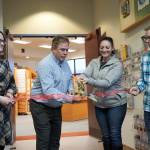 Kenai Cultural Center Coordinator Danielle Lopez Stamm, Kenai Mayor Brian Gabriel, Kenai Chamber of Commerce Executive Director Samantha Springer and Kenai Chamber of Commerce Board President Greg Stein cut the ribbon for the grand reopening of the cultural center at the Kenai Chamber of Commerce and Visitor Center in Kenai, Alaska, on Wednesday, Jan. 15, 2025. (Jake Dye/Peninsula Clarion)