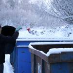 Kenai Peninsula Borough Mayor Peter Micciche dumps aluminum cans into recycling containers at the Central Peninsula Landfill in Soldotna, Alaska, on Thursday, Jan. 16, 2025. (Jake Dye/Peninsula Clarion)