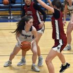 Soldotnas Grayson Henry faces a trap from Jasmine Schaeffer and Keelie Kronberger of Mountain City Christian Academy on Friday, Jan. 17, 2025, at Soldotna High School in Soldotna, Alaska. (Photo by Jeff Helminiak/Peninsula Clarion)