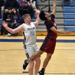 Jaidhen Oyao of Mountain City Christian Academy drives against Theo Huff of Soldotna on Friday, Jan. 17, 2025, at Soldotna High School in Soldotna, Alaska. (Photo by Jeff Helminiak/Peninsula Clarion)