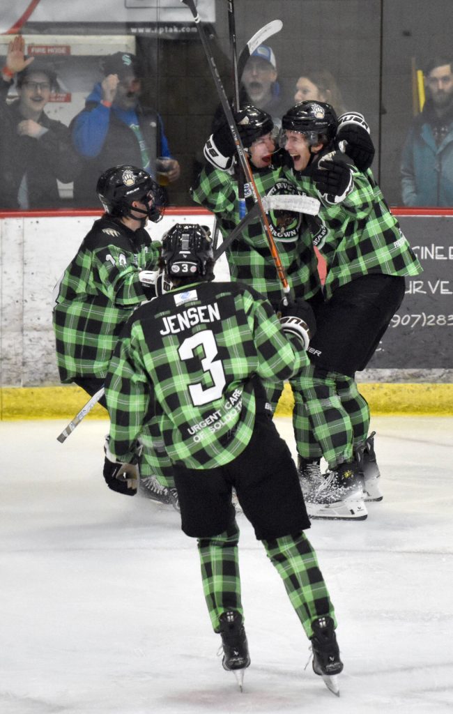 The Kenai River Brown Bears celebrate the game-winning goal of Dario Lass on Saturday, Jan. 18, 2025, at the Soldotna Regional Sports Complex in Soldotna, Alaska. (Photo by Jeff Helminiak/Peninsula Clarion)
