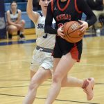 Kenai Centrals Sierra Hershberger drives on Grayson Henry on Friday, Jan. 24, 2025, at the Revolution Sport and Spine Therapy Al Howard Shootout at Soldotna High School in Soldotna, Alaska. (Photo by Jeff Helminiak/Peninsula Clarion)