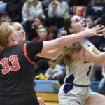 Soldotnas Anaulie Sedivy drives past Kenai Centrals Ellsi Miller and Gracee Every on Friday, Jan. 24, 2025, at the Revolution Sport and Spine Therapy Al Howard Shootout at Soldotna High School in Soldotna, Alaska. (Photo by Jeff Helminiak/Peninsula Clarion)