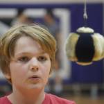 An athlete prepares to attempt the one-foot high kick during the Kahtnuhtana Hey Chiula Native Youth Olympics Invitational at Skyview Middle School near Soldotna, Alaska, on Sunday, Jan. 26, 2025. (Jake Dye/Peninsula Clarion)
