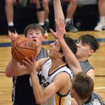Alek McGarry of Cook Inlet Academy drives against Nikiski on Tuesday, Jan. 28, 2025, at Cook Inlet Academy just outside of Soldotna, Alaska. (Photo by Jeff Helminiak/Peninsula Clarion)