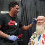 Mersha Tamrat gives free haircuts during the 14th Annual Project Homeless Connect at the Soldotna Regional Sports Complex in Soldotna, Alaska, on Tuesday, Jan. 28, 2025. (Jake Dye/Peninsula Clarion)
