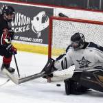 Kenai Centrals Logan Mese scores the game-winner in overtime against Soldotna goalie Brycen Clyde on Thursday, Jan. 30, 2025, at the Soldotna Regional Sports Complex in Soldotna, Alaska. (Photo by Jeff Helminiak/Peninsula Clarion)