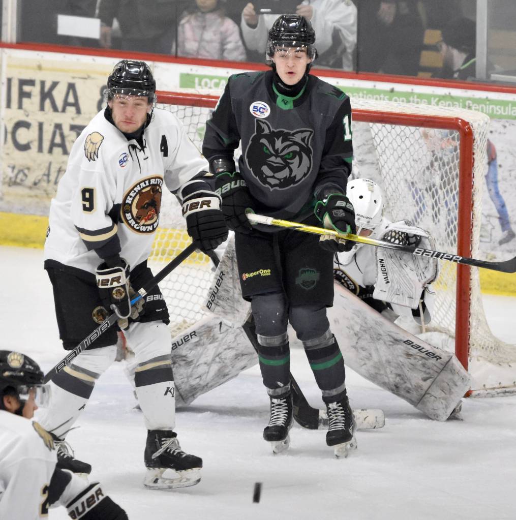 Kenai River defenseman Riley Mullen, Minnesota Wilderness forward Avery Anderson and Kenai River goalie Mitchell Mccusker face down a shot Saturday, Feb. 1, 2025, at the Soldotna Regional Sports Complex in Soldotna, Alaska. (Photo by Jeff Helminiak/Peninsula Clarion)