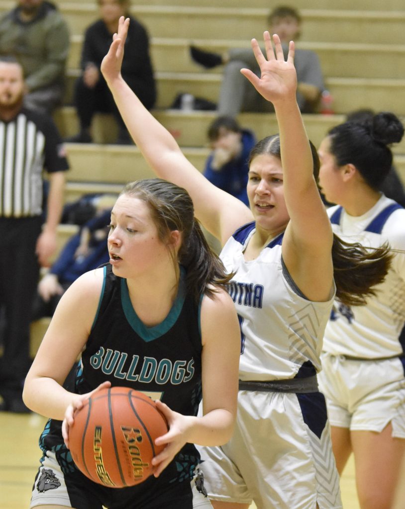 Nikiskis Addison Perkins keeps the ball from Soldotnas Laurel Johnson on Tuesday, February 5, 2025, at Nikiski Middle-High School in Nikiski, Alaska. (Photo by Jeff Helminiak/Peninsula Clarion)
