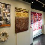 Artwork by Susan Nabholz, Charlotte Coots and Chelline Larsen is displayed as part of Fiber at the Kenai Art Center in Kenai, Alaska, on Wednesday, Feb. 5, 2025. (Jake Dye/Peninsula Clarion)