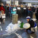 Jamiann Seiltin Hasselquist asks participants to kneel as a gesture to stay grounded in the community during a protest in front of the Alaska State Capitol on Wednesday focused on President Donald Trumps actions since the beginning of his second term. (Mark Sabbatini / Juneau Empire)