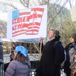 Stephanie Strickland, and her son, Benjamin, 11, hold a sign he made during a protest in front of the Alaska State Capitol on Wednesday focused on President Donald Trumps actions since the beginning of his second term. (Mark Sabbatini / Juneau Empire)