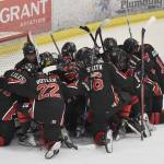 The Kenai Central hockey team huddles together after losing to Soldotna in the semifinals Friday, Feb. 7, 2025, at the First National Cup Division II state hockey tournament at the Soldotna Regional Sports Complex in Soldotna, Alaska. (Photo by Jeff Helminiak/Peninsula Clarion)
