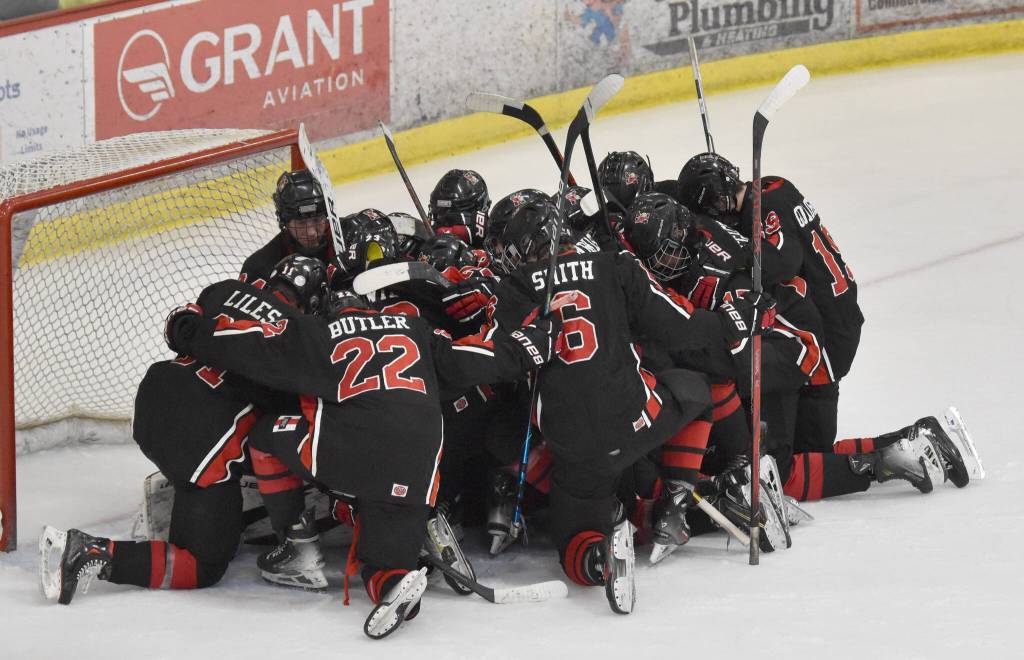 The Kenai Central hockey team huddles together after losing to Soldotna in the semifinals Friday, Feb. 7, 2025, at the First National Cup Division II state hockey tournament at the Soldotna Regional Sports Complex in Soldotna, Alaska. (Photo by Jeff Helminiak/Peninsula Clarion)