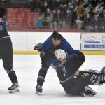 Palmer mobs goalie Emily Christman after defeating Soldotna for the championship at the First National Cup Division II state hockey tournament Saturday, February 8, 2025, at the Soldotna Regional Sports Complex in Soldotna, Alaska. (Photo by Jeff Helminiak/Peninsula Clarion)