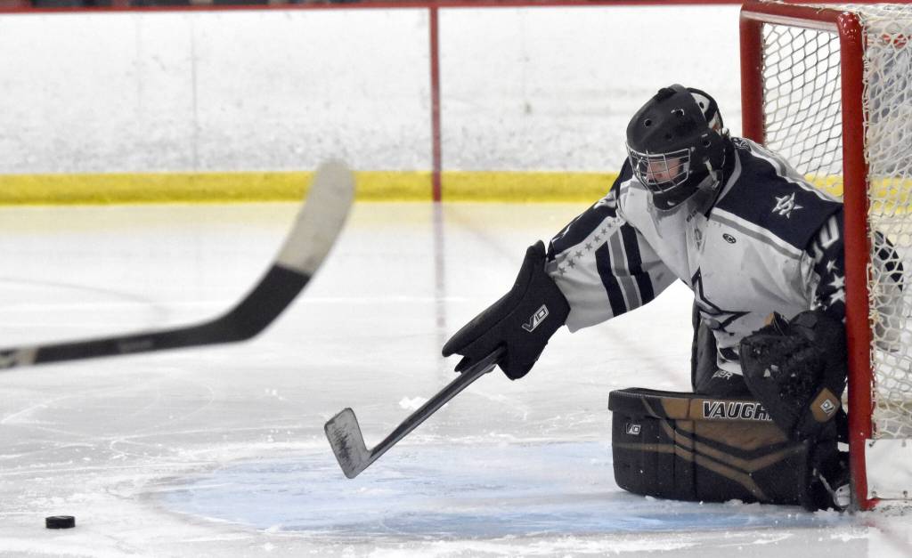 Soldotna goalie Brycen Clyde makes a save at the First National Cup Division II state hockey tournament Saturday, February 8, 2025, at the Soldotna Regional Sports Complex in Soldotna, Alaska. (Photo by Jeff Helminiak/Peninsula Clarion)