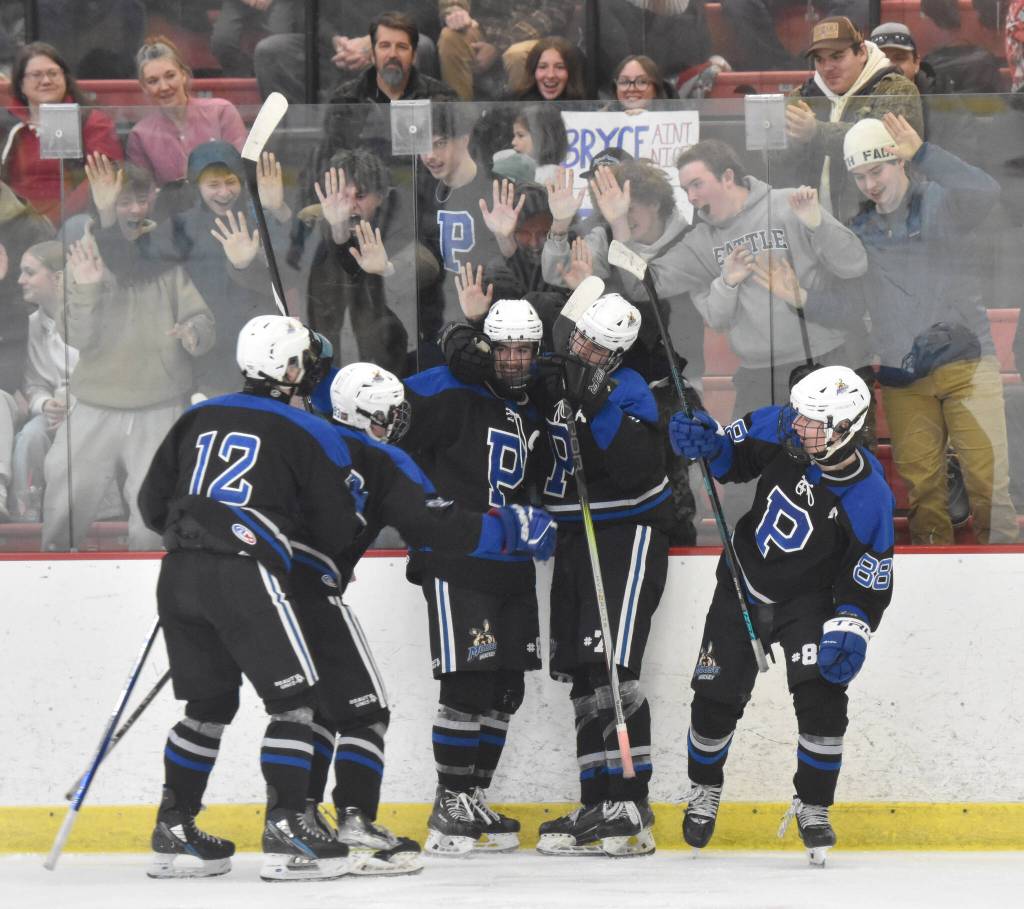 Palmer celebrates a goal by Elijah Von Gunten (7) at the First National Cup Division II state hockey tournament Saturday, February 8, 2025, at the Soldotna Regional Sports Complex in Soldotna, Alaska. (Photo by Jeff Helminiak/Peninsula Clarion)