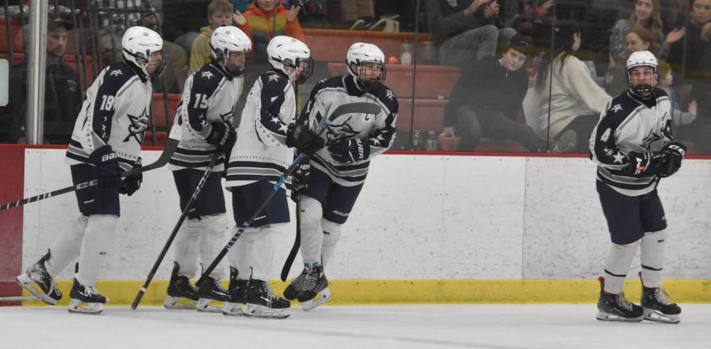 Soldotna celebrates a goal by Daniel Heath (second from left) at the First National Cup Division II state hockey tournament Saturday, February 8, 2025, at the Soldotna Regional Sports Complex in Soldotna, Alaska. (Photo by Jeff Helminiak/Peninsula Clarion)