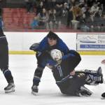 Palmer mobs goalie Emily Christman after defeating Soldotna for the championship at the First National Cup Division II state hockey tournament Saturday, February 8, 2025, at the Soldotna Regional Sports Complex in Soldotna, Alaska. (Photo by Jeff Helminiak/Peninsula Clarion)