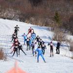 Varsity boys trek up the first hill at the Lookout Mountain Cross Country Ski Trails after starting their race on Saturday, Feb. 8, 2025. (Chloe Pleznac/Homer News)