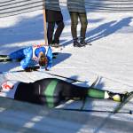 Soldotnas Tania Boonstra and Colonys Elliot Sensabaugh collapse in exhaustion and adrenaline at the finish line on Saturday, Feb. 8, 2025. The girls placed 1st and 2nd overall for the weekend, with Boonstra winning the title of girls Skimeister with an overall time 5 seconds faster than Sensabaugh. (Chloe Pleznac/Homer News)