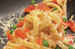 Creamy pasta is served with smoked salmon and Parmesan. (Photo by Tressa Dale/Peninsula Clarion)