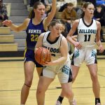 Nikiskis Avery Ellis pulls down a rebound in front of Homers Madalyn Miotke on Tuesday, February 11, 2025, at Nikiski Middle-High School in Nikiski, Alaska. (Photo by Jeff Helminiak/Peninsula Clarion)
