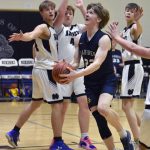 Homers Henry Wedvik drives on Nikiski on Tuesday, February 11, 2025, at Nikiski Middle-High School in Nikiski, Alaska. (Photo by Jeff Helminiak/Peninsula Clarion)