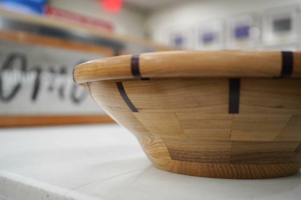 Wooden bowls crafted by Nikiski Middle/High School students are displayed during a meeting of the Kenai Peninsula Borough School Districts Board of Education in Soldotna, Alaska, on Monday, Feb. 3, 2025. (Jake Dye/Peninsula Clarion)