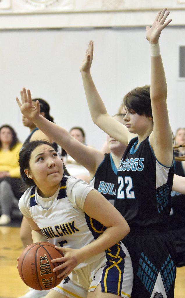 Ninilchiks Kate Hendryx looks for a shot against Folesha Anderson of Nikiski JV at the Keith Presley Memorial Tournament on Friday, February 14, 2025, at Ninilchik School in Ninilchik, Alaska. (Photo by Jeff Helminiak/Peninsula Clarion)