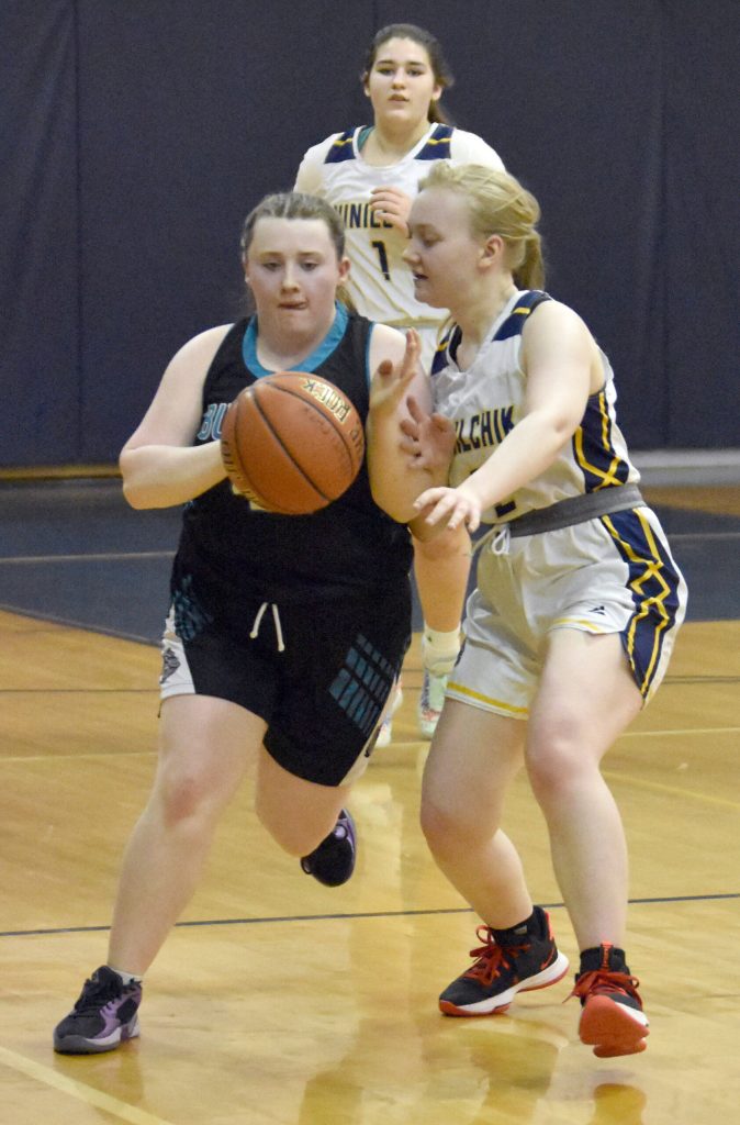 Kylie Northington of Nikiski JV brings the ball up against Ninilchiks Audry Herndon at the Keith Presley Memorial Tournament on Friday, February 14, 2025, at Ninilchik School in Ninilchik, Alaska. (Photo by Jeff Helminiak/Peninsula Clarion)