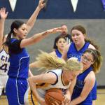 Cook Inlet Academys Brandi Harkleroad battles Phontina Demas and Emma Tanape of Nanwalek for the ball Saturday, February 15, 2025, at Cook Inlet Academy just outside of Soldotna, Alaska. (Photo by Jeff Helminiak/Peninsula Clarion)