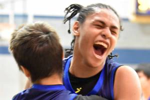 Marcarius Evans of Nanwalek celebrates a victory over Cook Inlet Academy on Saturday, February 15, 2025, at Cook Inlet Academy just outside of Soldotna, Alaska. (Photo by Jeff Helminiak/Peninsula Clarion)