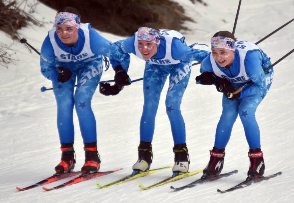 Soldotnas Ariana Cannava, Tania Boonstra and Kate Cox approach the finish line in the lead of the 4-kilometer freestyle girls race at the Kenai Peninsula Borough meet Saturday, February 15, 2025, at Tsalteshi Trails just outside of Soldotna, Alaska. (Photo by Jeff Helminiak/Peninsula Clarion)