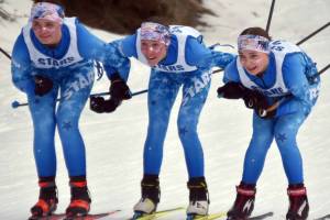 Soldotna's Ariana Cannava, Tania Boonstra and Kate Cox approach the finish line in the lead of the 4-kilometer freestyle girls race at the Kenai Peninsula Borough meet Saturday, February 15, 2025, at Tsalteshi Trails just outside of Soldotna, Alaska. (Photo by Jeff Helminiak/Peninsula Clarion)