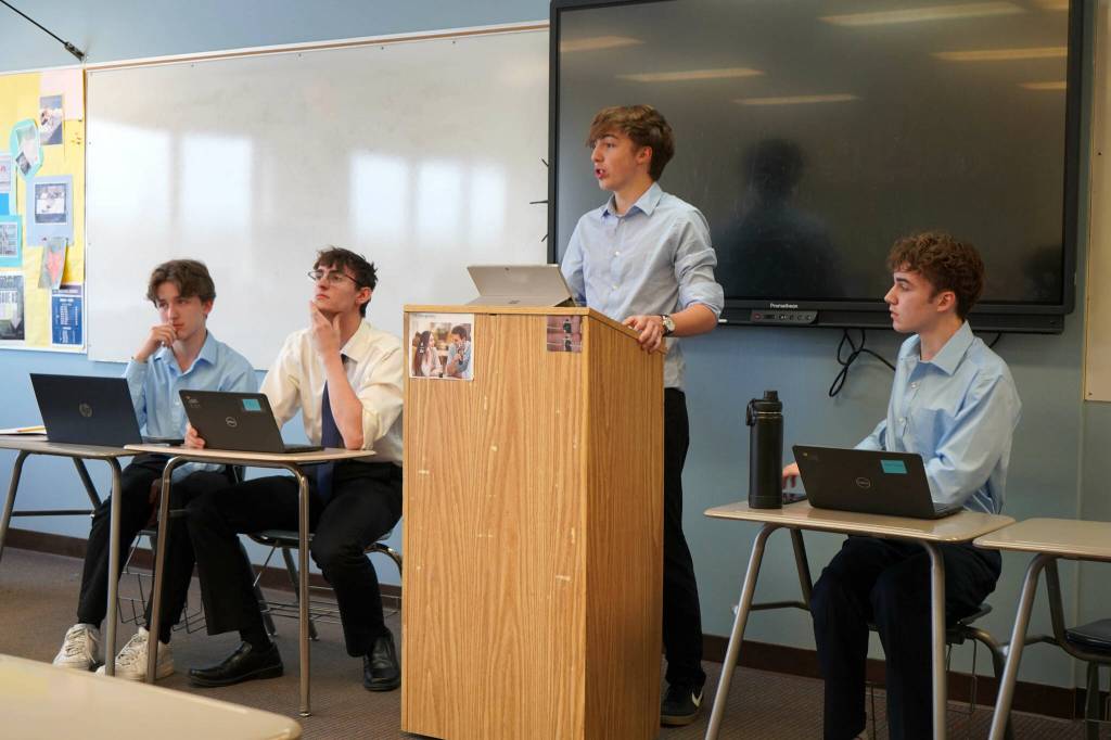 Kenneth Fine and Connor Marks, left, debate Cy Garcia and Ethan Anding, right, during the Kenai Peninsula Borough School District Drama, Debate and Forensics Invitational at Soldotna High School on Saturday, Feb. 15, 2025. (Jake Dye/Peninsula Clarion)