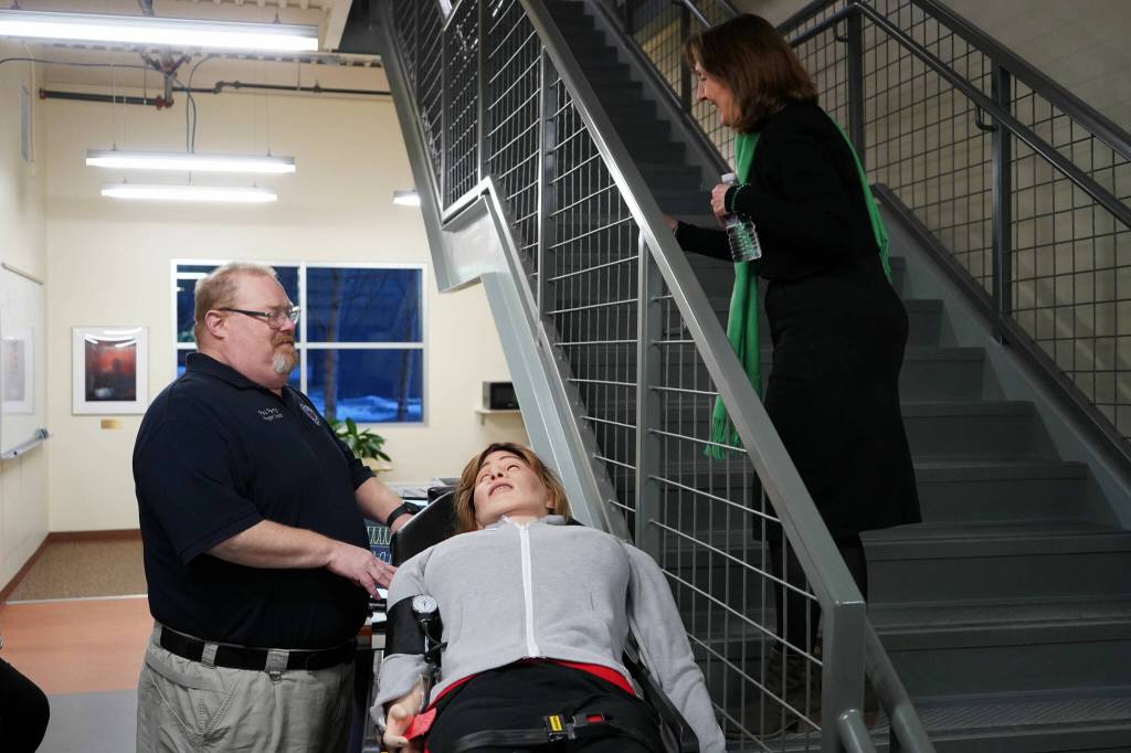 Paul Perry, assistant professor of paramedic technology, speaks to University of Alaska Anchorage Provost Denise Runge at a showcase of Kenai Peninsula Colleges career and technical education programs in the colleges Career and Technical Center in Soldotna, Alaska, on Thursday, Feb. 20, 2025. (Jake Dye/Peninsula Clarion)
