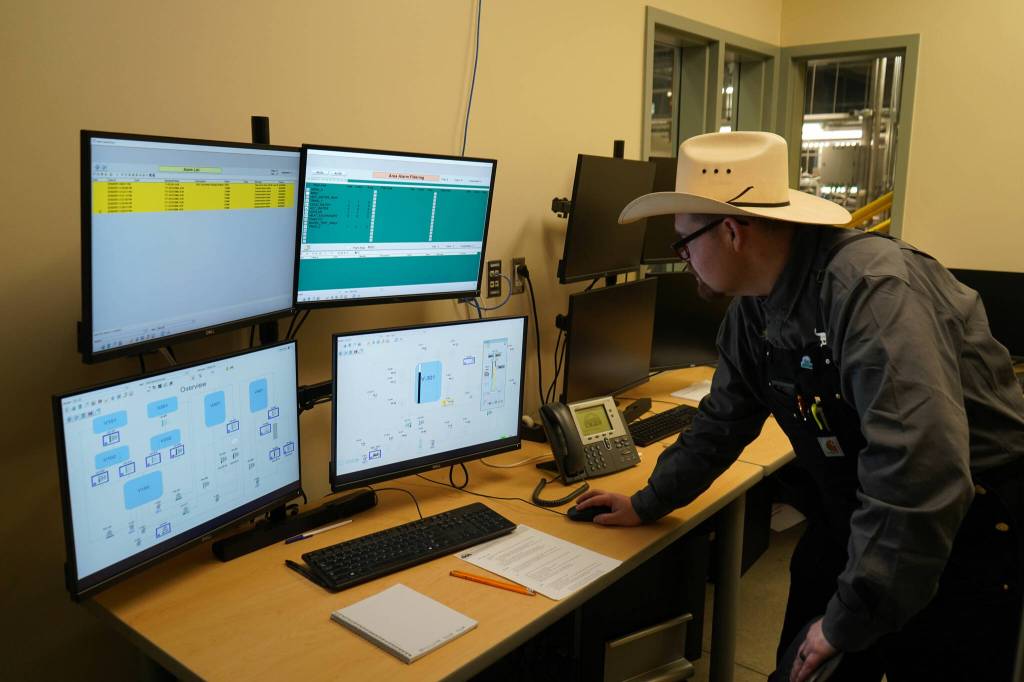 Joe Reynolds operates water pumps at a showcase of Kenai Peninsula Colleges career and technical education programs in the colleges Career and Technical Center in Soldotna, Alaska, on Thursday, Feb. 20, 2025. (Jake Dye/Peninsula Clarion)